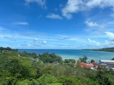 a view of the ocean from a hill at Oceana Kamala Stunning corner Suite Sea View in Kamala Beach