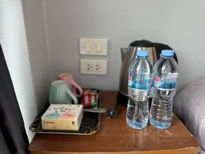 two bottles of water are sitting on a table at \u30d1\u30c8\u30f3\u30eb\u30fc\u30e07 in Patong Beach