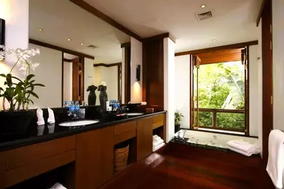 a bathroom with a sink and a bath tub at 00 - Thai Paradise on Kamala Bay in Amphoe Thalang