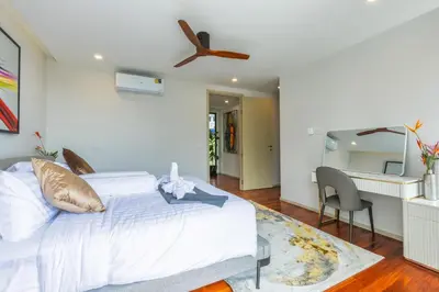a bedroom with a bed and a ceiling fan at 