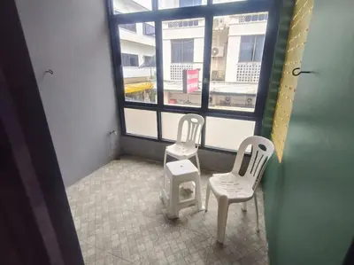 two white chairs and a window in a room at Bonanza Patong Beach2 for 2 BR 100m to Beach Grand Room in Patong Beach