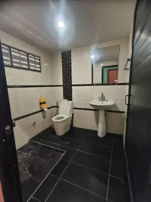 a bathroom with a toilet and a sink at Bonanza Patong Beach2 for 2 BR 100m to Beach Grand Room in Patong Beach