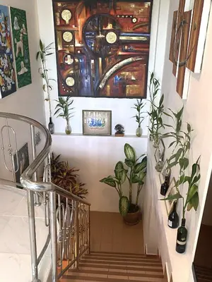 a staircase with plants and a glass ceiling at BOUTIQUE-VILLA with Suites & Rooms in Karon Beach