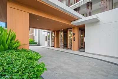 an external view of a building with a corridor at Angsana Oceanview Residences in Laguna by Banyan Living in Laguna Phuket