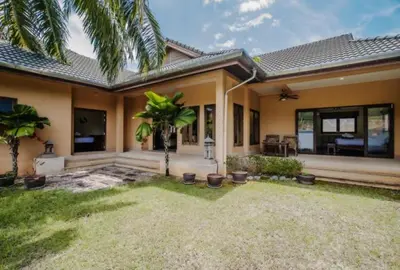 a home with a palm tree in the yard at NEW Phuket Residence 2 Bedrooms Charming House in Rawai Beach