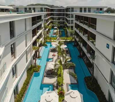an aerial view of the pool at the resort at Kora Beach Resort Phuket in Bang Tao Beach