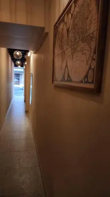 a hallway with a picture on a wall with a map at IHOC - Phuket OldTown in Ban Lo Long