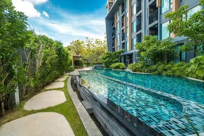 a swimming pool in the middle of a building at Aristo Resort M08 Surin Beach in Surin Beach