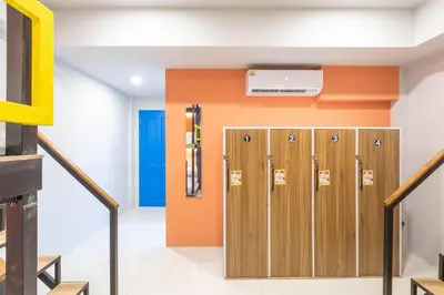 a row of lockers in a room with stairs at Mellow Poshtel - Kata Beach in Kata Beach