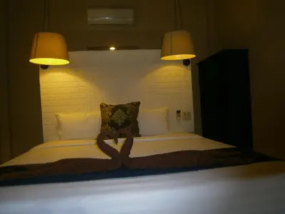 a bed with a heart carved on it at Infinity Boutique Hotel Kata Beach in Kata Beach
