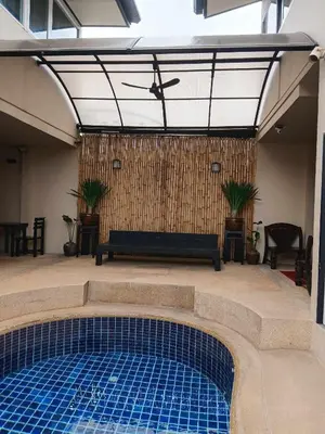 a swimming pool in the middle of a patio at Infinity Boutique Hotel Kata Beach in Kata Beach