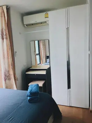 a bedroom with a bed and a mirror at 02Nice room phuket town near Shopping Malls and Naka night market in Phuket Town
