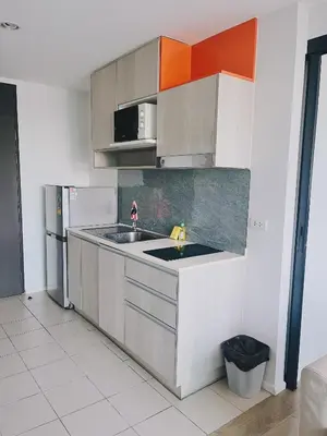 a kitchen with a sink and a refrigerator at 02Nice room phuket town near Shopping Malls and Naka night market in Phuket Town