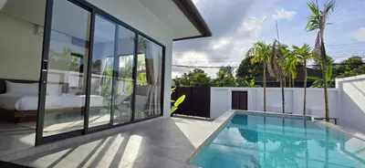a house with a swimming pool next to a bedroom at Seava House Ao-Nang Krabi in Ao Nang Beach
