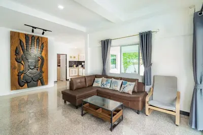 a living room with a couch and a chair at Pool Villa 3 Bedrooms, Closeby Patong, Chic and Quiet in Kathu