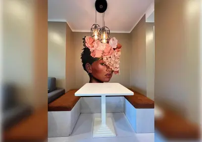 a table with a head with flowers on it at Karon Butterfly Residence in Kata Beach
