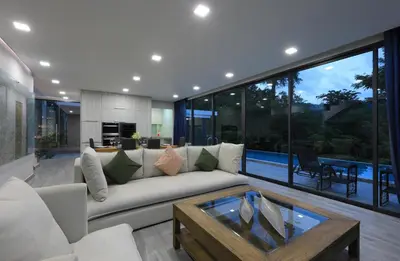a living room with a couch and a table at 4BDR Sugar Villa 2 in Kamala Beach