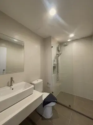 a bathroom with a sink and a toilet and a shower at Sunny Balcony in Ban Khlong Haeng