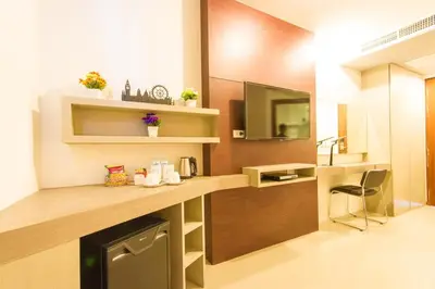 a room with a kitchen with a counter and a sink at Hemingways Silk Hotel in Patong Beach