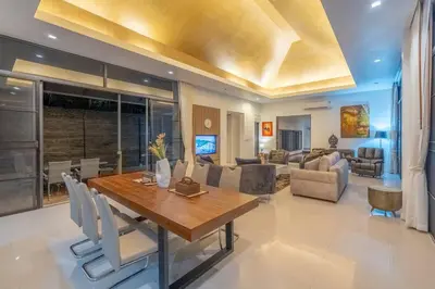 a dining room and living room with a table and chairs at High End Imported Furniture Loch Palm Golf Course V145 in Kathu