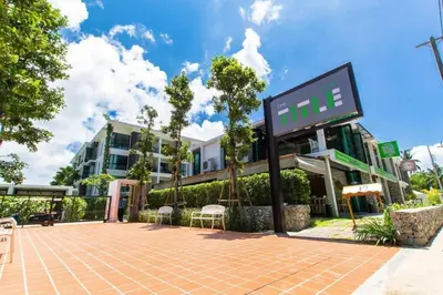 a building with a sign in front of it at Neatest Apartment 50m To Main Street And Beach C149 in Rawai Beach