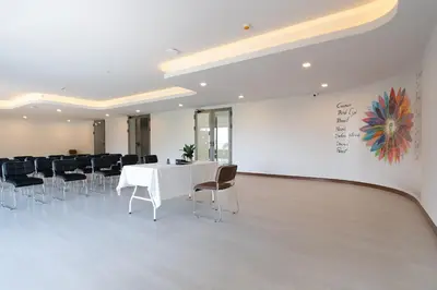 a conference room with a white table and chairs at The Blue Mavi Hotel in Chalong