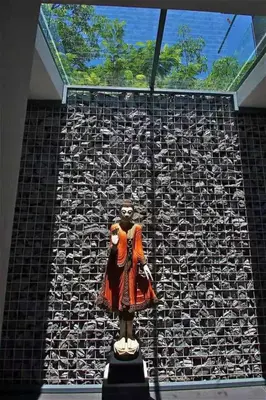 a statue of a woman on display in front of a wall at Ocean Heart 5BDR Seaview LUX villa in Ban Bang La