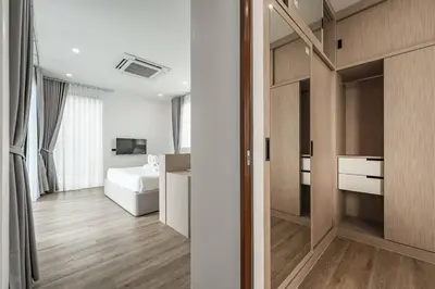 a room with a bedroom with a bed and a desk at Peaceful Paradise in Saiyuan Villa V147 in Rawai Beach