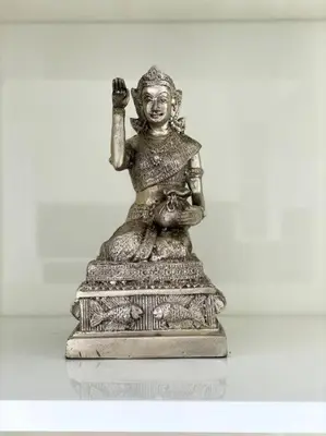a statue of a woman sitting on a table at Kata Ocean View 1 bedroom 50 m2 in Kata Beach