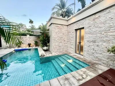 a swimming pool in the backyard of a house at Pool villa at The Residence near BangTao beach in Bang Tao Beach