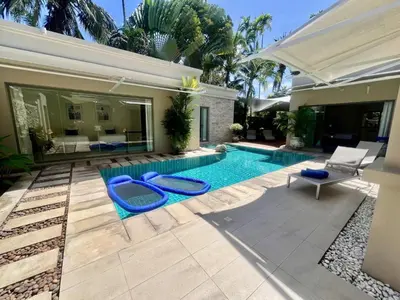a swimming pool in the backyard of a house at Pool villa at The Residence near BangTao beach in Bang Tao Beach
