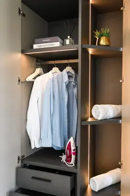 a walk in closet with clothes and a shoe at Brand New Luxury 3BR with Private Hammam in Chalong
