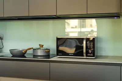 a microwave sitting on a counter in a kitchen at Brand New Luxury 3BR with Private Hammam in Chalong
