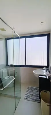 a bathroom with a glass shower and a sink at Bangtao Beach 600m Laguna 3BDR 3,5bath with Jacuzzi and BBQ up to 8 guests 5 nights Free taxi in Phuket