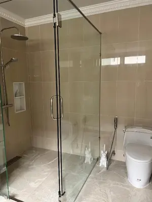 a bathroom with a glass shower with a toilet at Gold Chariot 4BR villa with pool in Phuket