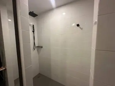 a bathroom with a shower with a shower at Modern apartment on Naiharn Beach B404 in Rawai Beach