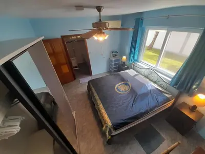 an overhead view of a bed in a room with a window at 2,5 Zimmerwohnung mit Pool und Pavillon in Rawai Beach