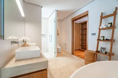 a bathroom with a white sink and a mirror at Modern 3BR Pool Villa at Anchan Flora in Bangtao in Bang Tao Beach