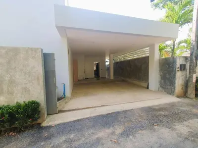 an empty garage in a building with the door open at Modern pool villa 3 bedrooms in Rawai Beach
