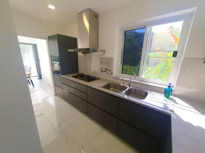 a kitchen with a sink and a window at Modern pool villa 3 bedrooms in Rawai Beach