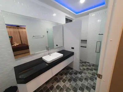 a bathroom with a sink and a mirror at Modern pool villa 3 bedrooms in Rawai Beach