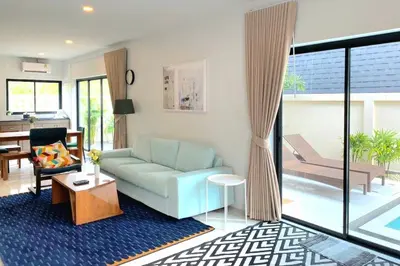 a living room with a couch and a table at Krabi Private Pool Villa 2 by Belcarra Spaces in Ban Khlong Haeng