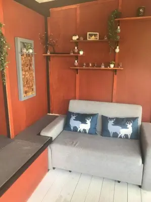 a room with a bench with two pillows on it at Cancel in Phang-nga