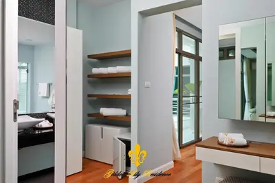 a bathroom with white walls and a mirror at Golden Lily 4 Bedroom Private Pool Villa in Rawai Beach