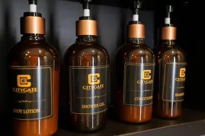 a group of four bottles of wine on a shelf at 600m to beach New City gate P214 #c60 in Kamala Beach