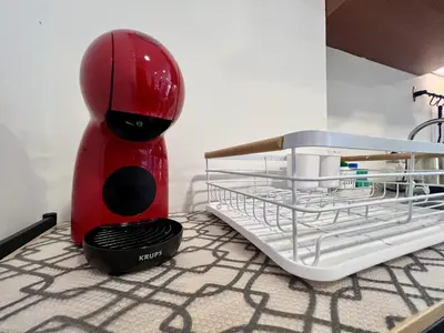 a red blender sitting on top of a kitchen counter at Mai Khao Serenity in Ban Mai Salae