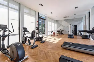 a gym with treadmills and exercise equipment in a building at Saturdays Residence 1 bedroom Rawai in Ban Saiyuan (1)