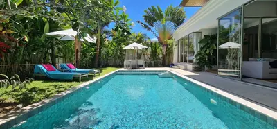 a swimming pool in the backyard of a house at Luxury 3 bedroom pool villa in Laguna Phuket