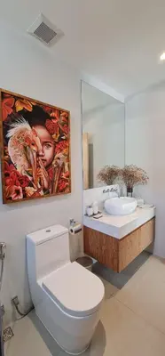 a bathroom with a white toilet and a sink at Luxury 3 bedroom pool villa in Laguna Phuket