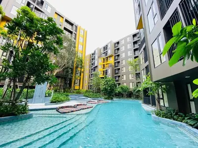 a swimming pool in the middle of a city with buildings at The Base Central Phuket-C4YW in Phuket Town